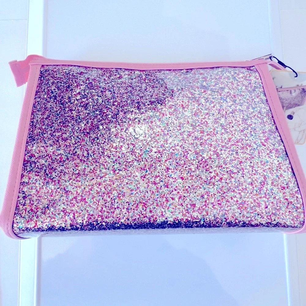 Pink Glitter Cosmetic Bag with a Silver Heart on Clear Vinyl & a Silver Zipper.